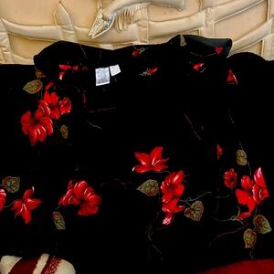 Woman’s tall size 12 black floral skirt.  Elastic waist with flair bottom, slip.